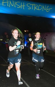 Participants in the annual "Glow In The Park" 5K fun run at MacArthur Park at Joint Base San Antonio-Fort Sam Houston "finish strong" Feb. 24.