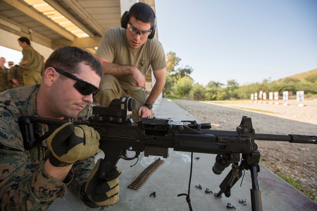 A Marine prepares to shoot a machine gun during an exercise in Israel.