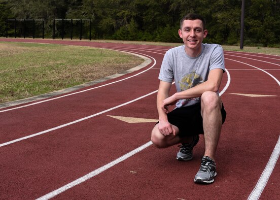 U.S. Air Force Airman 1st Class Kyle Sutton, 33rd Fighter Wing financial management analyst, pauses at a running track Feb. 16, 2017, at Eglin Air Force Base, Fla. Sutton began running on a cross country team in high school and carried the his love for the sport over into his Air Force career. (U.S. Air Force photo by Airman 1st Class Emily Smallwood)
