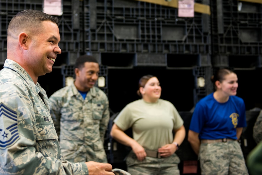 Chief Master Sgt. Ronald Killen, 23d Logistics Readiness Squadron (LRS) superintendent, shares a laugh with Airmen from the 23d LRS while they prepared for a Phase 1 exercise, Feb. 23, 2018, at Moody Air Force Base, Ga. The 23d LRS prepped approximately 400 A-bags, which consisted of items essential for deploying Airmen. This helped ensure the success of the Airmen participating in the exercise, which tested operations, maintenance and logistics to demonstrate the 23d Wing’s ability to rapidly deploy to meet the needs of combatant commanders. (U.S. Air Force photo by Airman 1st Class Erick Requadt)