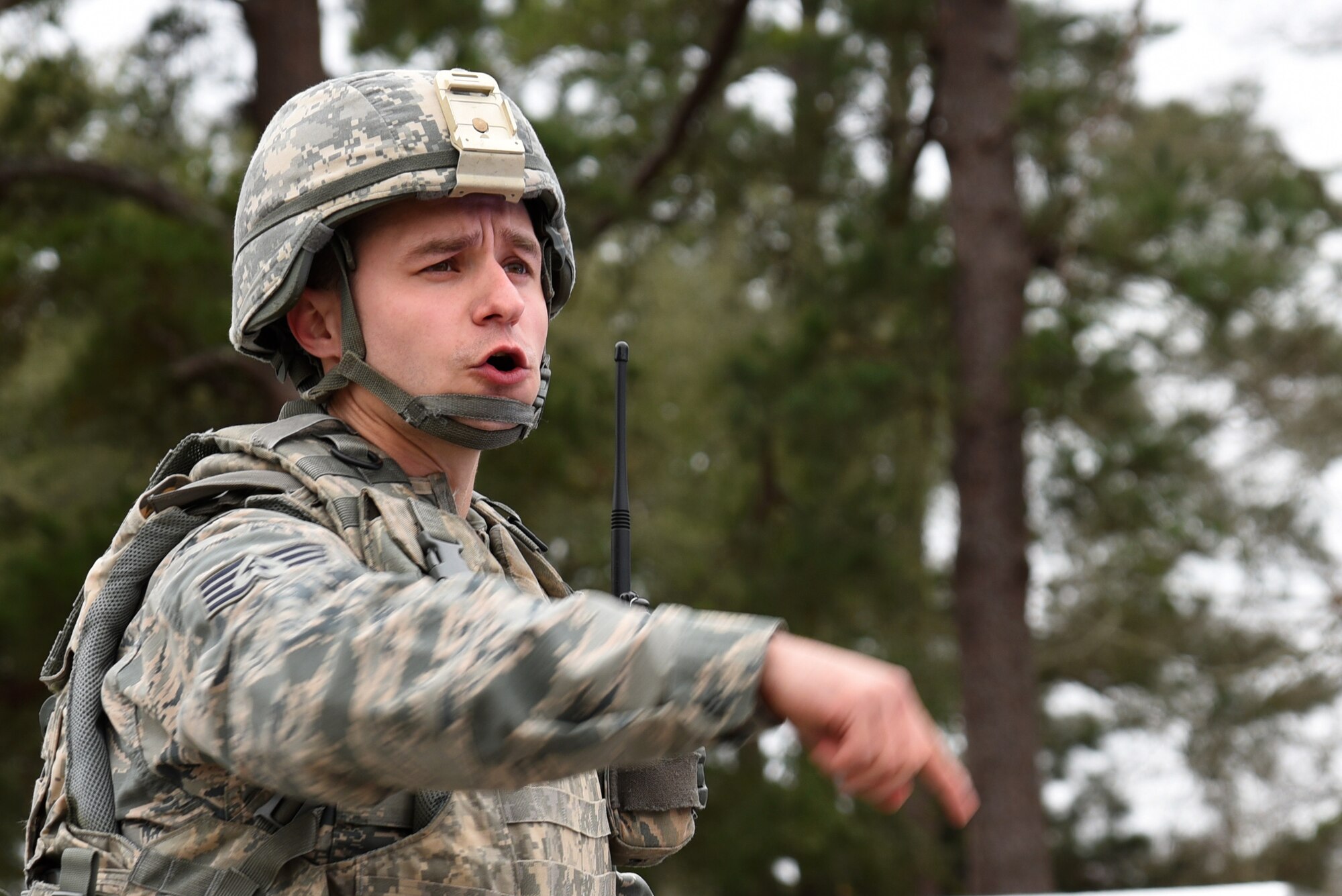 U.S. Air Force Staff Sgt. Ilya Makarenko, 20th Security Forces Squadron installation patrolman, directs fellow defenders during an exercise at Shaw Air Force Base, S.C., Feb. 13, 2018.