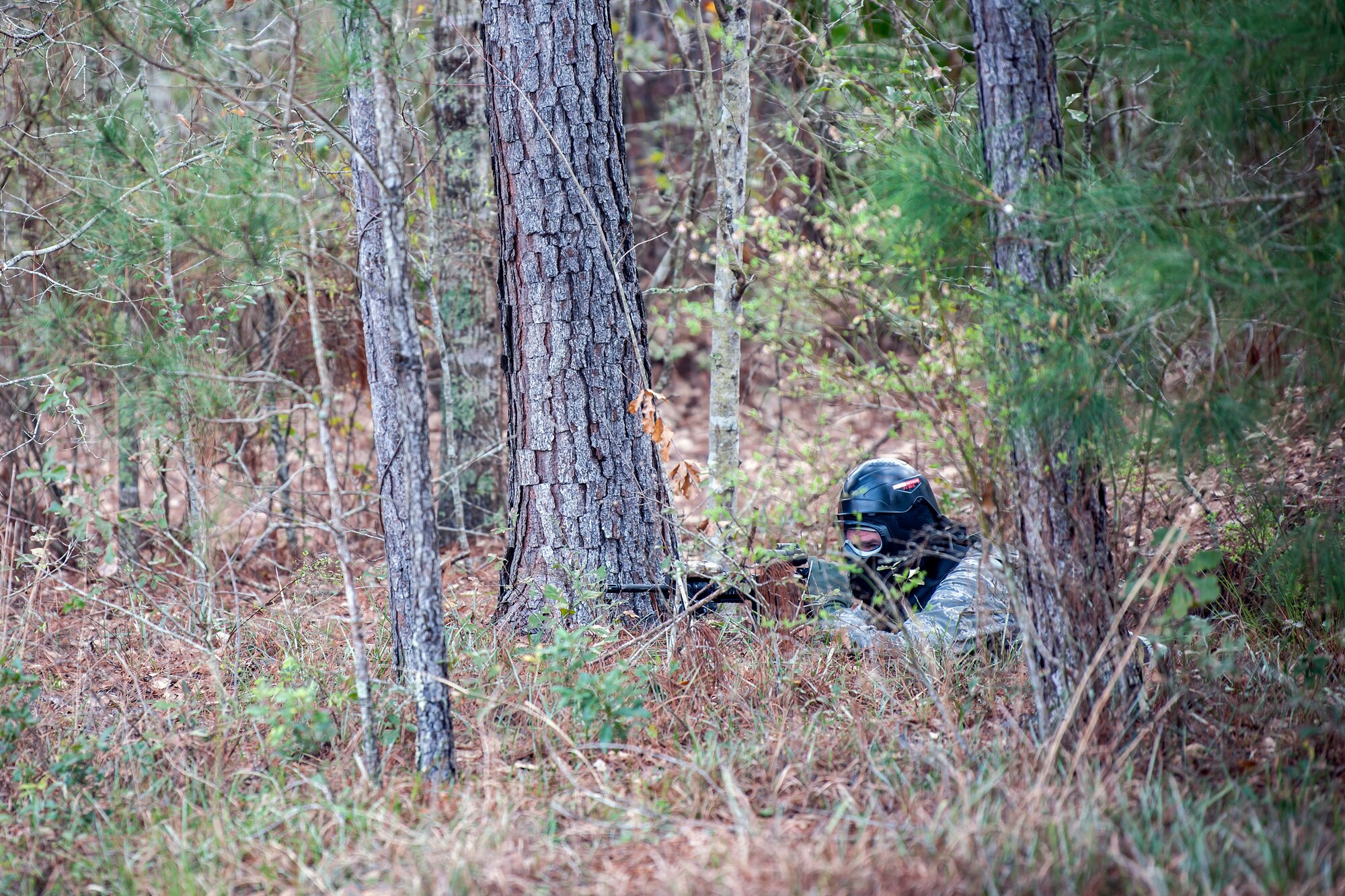 Tech. Sgt. Jebediah Hudgins, 23d Security Forces Squadron unit training manager, shoots an M4 carbine from a prone position, Feb. 22, 2018, at Moody Air Force Base, Ga.  The Shoot, move, communicate training event is designed to test participants on their ability to move from barricade to barricade as a team. To be successful, one member provided covering fire while others advanced on the enemy, then retreated from the scenario while they maintained cover fire. Security Forces members could employ these tactics anytime they’re under enemy fire.
(U.S. Air Force photo by Airman Eugene Oliver)