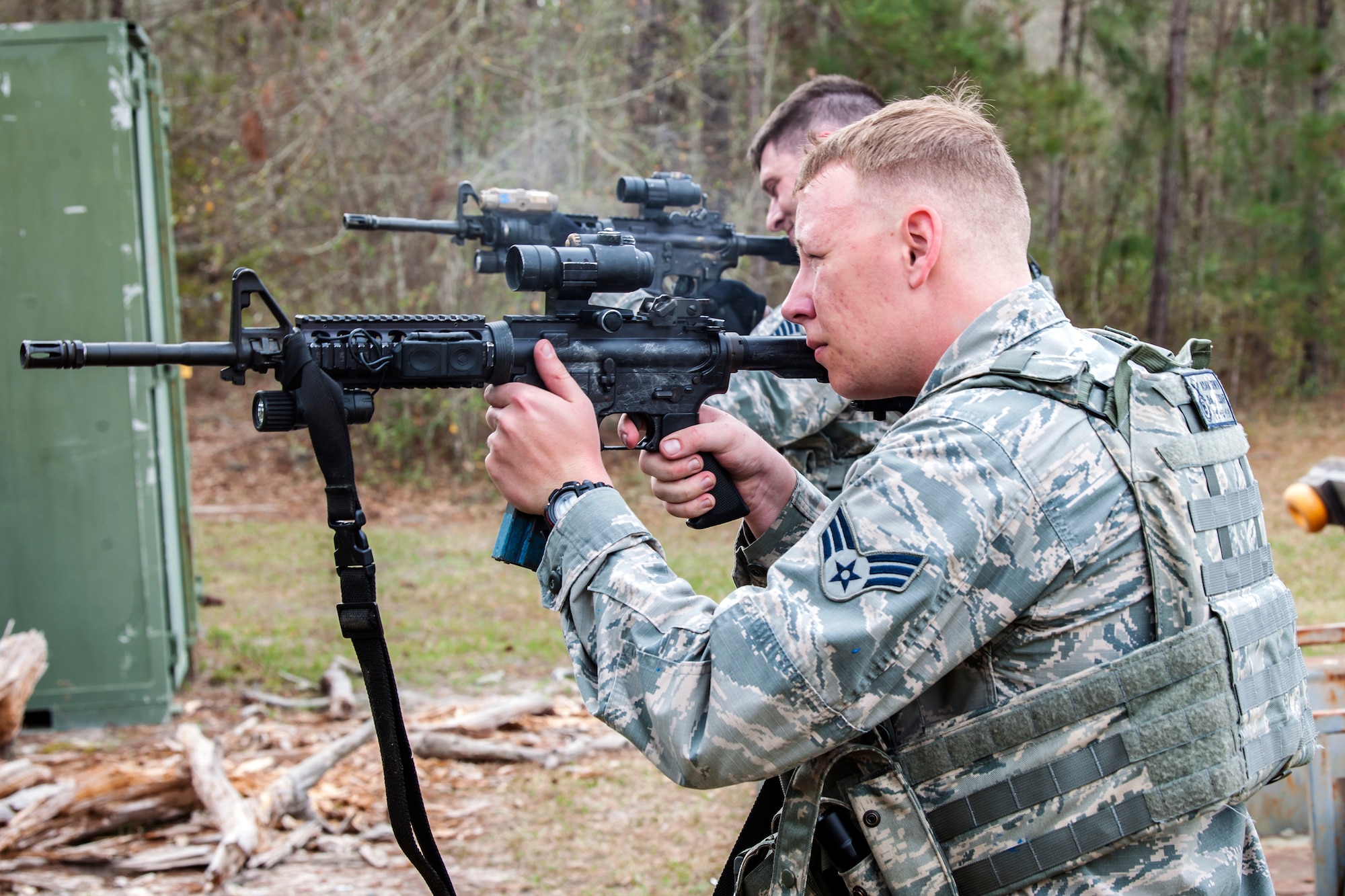 Senior Airman Adam Irwin, front, 23d Security Forces Squadron installation patrolman, and Tech Sgt. Stephen O’Hara, 23d Security Forces Squadron flight chief, fire M4 carbines after a training event, Feb. 22, 2018, at Moody Air Force Base, Ga.  The Shoot, move, communicate training event is designed to test participants on their ability to move from barricade to barricade as a team. To be successful, one member provided covering fire while others advanced on the enemy, then retreated from the scenario while they maintained cover fire. Security Forces members could employ these tactics anytime they’re under enemy fire.
(U.S. Air Force photo by Airman Eugene Oliver)