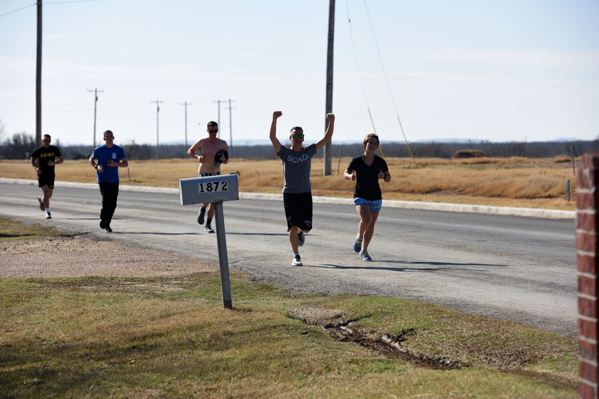 Competitors race in the 17th annual Polar Bear Plunge event hosted by the 17th Force Support Squadron around Lake Nasworthy in San Angelo, Texas Feb. 24, 2018. This is the second year that the event has included a run before the swim. (U.S. Air Force photo by Airman 1st Class Seraiah Hines/Released)