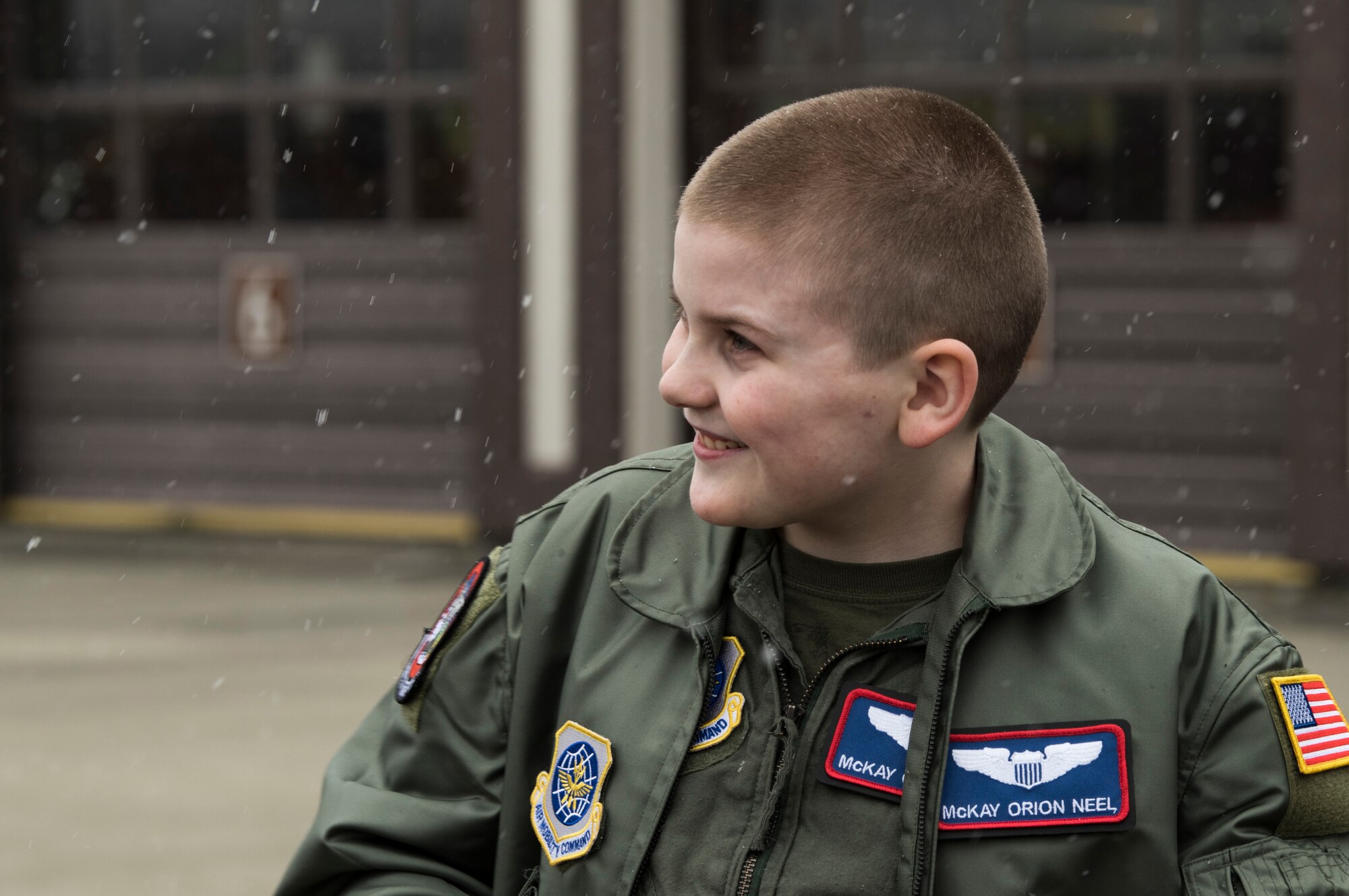 McKay Neel, McChord’s newest Pilot for a Day participant, learns about McChord’s fire station during a tour of McChord Field at Joint Base Lewis-McChord, Wash., Feb. 20, 2018. McKay received his own flight suit and jacket, 4th Airlift Squadron patches and coin and a C-17 Globemaster III model during his day as a 4th AS pilot. (U.S. Air Force photo by Senior Airman Tryphena Mayhugh)