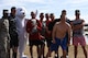 Members of the 312th Training Squadron, winners of this year’s trophy, stand with the 17th Force Support Squadron Polar Bear at the Polar Bear Plunge event at Lake Nasworthy, in San Angelo, Texas, Feb. 24, 2018. The trophy was awarded to the unit with the most participants in the plunge portion of the event on the lake. (U.S. Air Force photo by Airman 1st Class Seraiah Hines/Released)