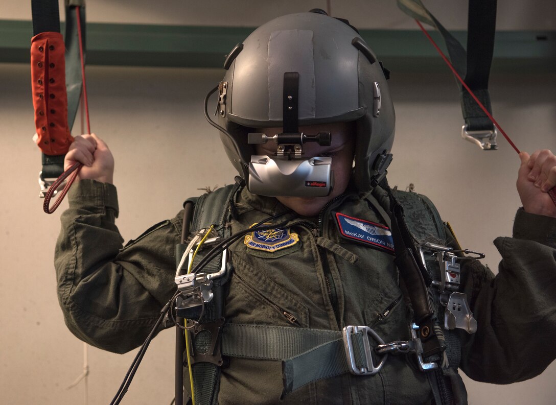 McKay Neel, McChord’s newest Pilot for a Day participant, operates a parachute simulation during his McChord Field tour at Joint Base Lewis-McChord, Wash., Feb. 20, 2018. McKay spent the day with the 4th Airlift Squadron touring multiple places on McChord Field to experience what it’s like to be a Team McChord pilot. (U.S. Air Force photo by Senior Airman Tryphena Mayhugh)