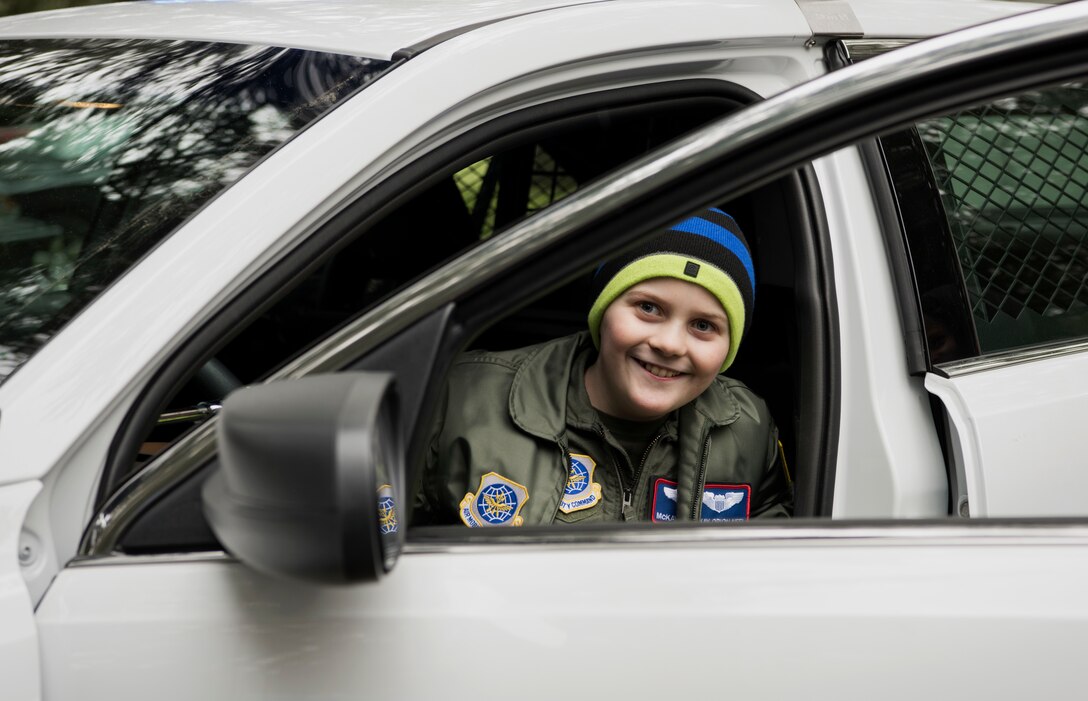 McKay Neel, McChord’s newest Pilot for a Day participant, sits in a new 62nd Security Forces Squadron patrol vehicle during a tour of McChord Field at Joint Base Lewis-McChord, Wash., Feb. 20, 2018. The Pilot for a Day program aims to give each child a break from whatever challenges they may face by giving them their own special day. (U.S. Air Force photo by Senior Airman Tryphena Mayhugh)