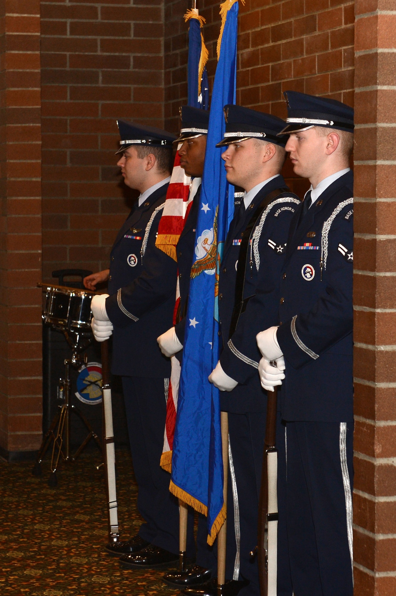 Members of the McChord Field Honor Guard prepare to present the U.S. and Air Force flags during the 2017 Annual Awards Banquet at the McChord Field Club, Joint Base Lewis-McChord, Wash., Feb. 23, 2018. The McChord Field Honor Guard participates in many official ceremonies as well as render military honors to Air Force personnel and their families during funeral services.