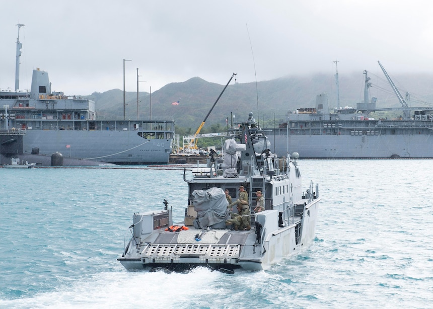 Sailors assigned to Coastal Riverine Squadron (CRS) 4, Det. Guam transit Apra Harbor aboard a Mark VI patrol boat prior to conducting a joint search and rescue exercise with the “Island Knights” of Helicopter Sea Combat Squadron (HSC) 25 and U.S. Coast Guard Sector Guam, Feb. 23.