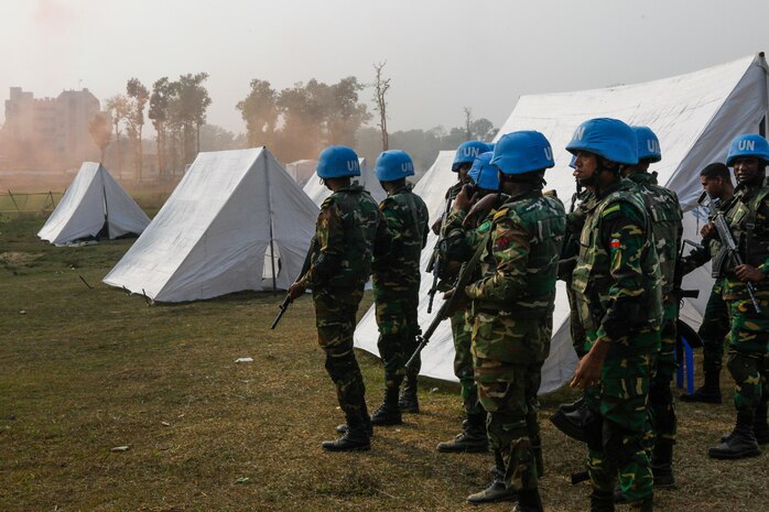 Bangladesh Army soldiers of the Engineer Corps prepare to counter attack role-players during a rehearsal for a demonstration as part of Exercise Shanti Doot 4 in Bangladesh.