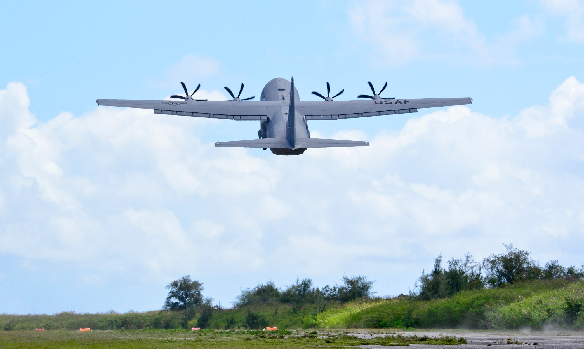 A U.S. Air Force C-130J Super Hercules, assigned to the 36th Airlift Squadron, takes off from Tinian, U.S. Commonwealth of the Northern Marianas Islands, during exercise COPE NORTH 18, Feb. 19, 2018. Through exercises and engagements during COPE NORTH 18, the U.S. Air Force, Royal Australian Air Force, and Koku Jieitai (Japan Air Self-Defense Force) sought to increase interoperability for humanitarian assistance/disaster relief operations. (U.S. Air Force photo by Airman 1st Class Christopher Quail)