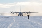 Staff Sgt. Latisha Webb, 139th Expeditionary Airlift Squadron crew chief, taxis an LC-130 “Skibird” into the fuel pit on the Williams Field skiway at McMurdo Station, Antarctica, on Nov. 6, 2017.