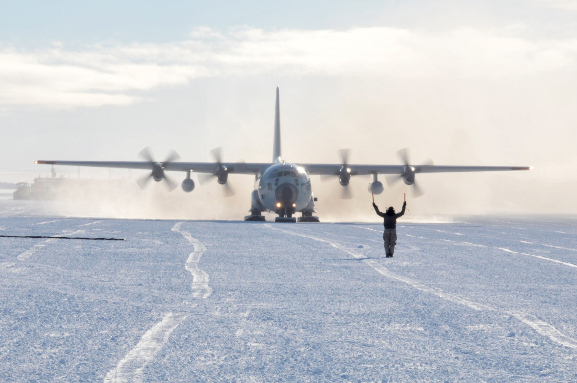 Staff Sgt. Latisha Webb, 139th Expeditionary Airlift Squadron crew chief, taxis an LC-130 “Skibird” into the fuel pit on the Williams Field skiway at McMurdo Station, Antarctica, on Nov. 6, 2017.