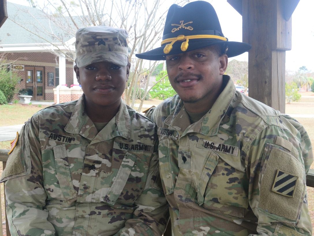 Army Sgt. Karrington Austin, left, and her husband, Spc. Dominque Austin, both assigned to the 5th Squadron, 7th Cavalry Regiment, pose for a photo at Fort Stewart, Ga., Feb. 12, 2018. For the first time in their careers, the Austins will face a deployment apart when Karrington deploys to South Korea this year. Army photo by Sgt. Ryan Tatum