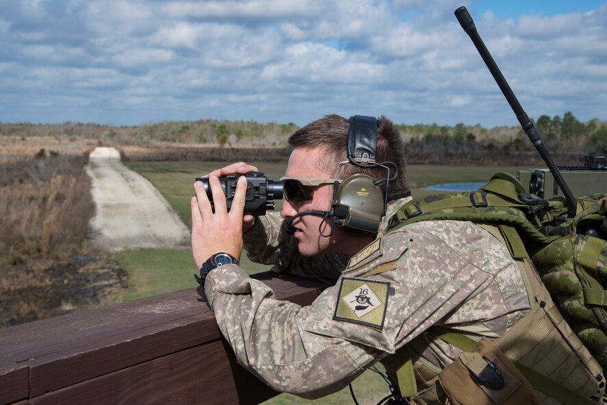 New Zealand army Corporal McDonald, NZA joint terminal air controller, uses a handheld laser to mark a target during combined training, Feb. 21, 2018, at Moody Air Force Base, Ga. Ally forces from the Canadian Royal Air Force and NZA traveled to Moody AFB to train with the 75th Fighter Squadron on close air support. (U.S. Air Force photo by Staff Sgt. Eric Summers Jr.)