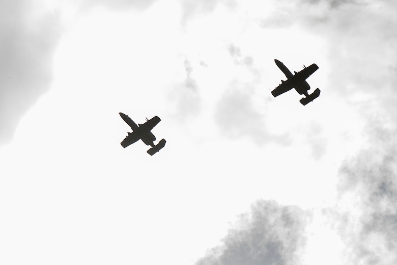 Two A-10C Thunderbolt II aircraft circle above Canadian Royal Air Force and New Zealand army joint terminal air controllers during combined training, Feb. 21, 2018, at Moody Air Force Base, Ga. Ally forces from the Canadian Royal Air Force and New Zealand army traveled to Moody AFB to train with the 75th Fighter Squadron on close air support. (U.S. Air Force photo by Staff Sgt. Eric Summers Jr.)
