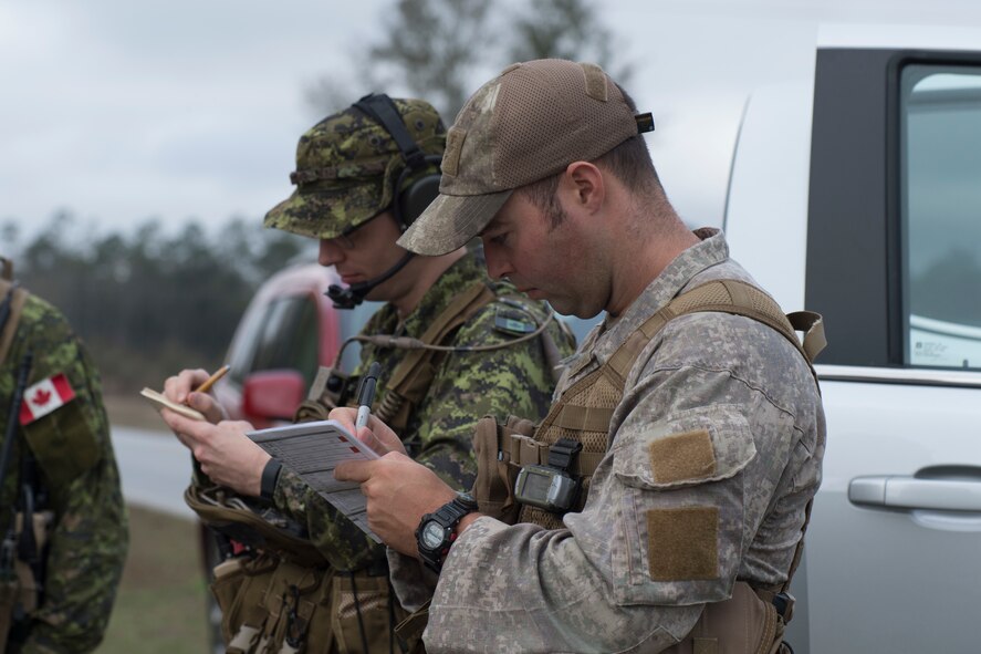 New Zealand army Capt. Price, joint terminal attack controller, transcribes information from an U.S. Air Force A-10C Thunderbolt II aircraft during combined training, Feb. 20, 2018, in Lakeland, Ga. Ally forces from the Canadian Royal Air Force and NZA traveled to Moody Air Force Base, Ga., to train with the 75th Fighter Squadron on close air support. (U.S. Air Force photo by Staff Sgt. Eric Summers Jr.)