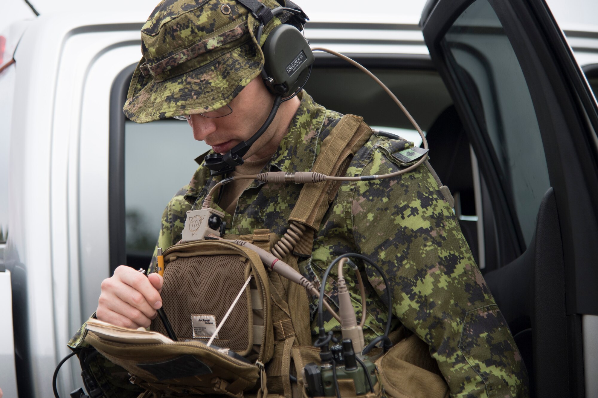 Canadian Royal Air Force Warrant Officer Macintyre, joint terminal attack controller, uses a device to confirm coordinates during combined training, Feb. 20, 2018, in Lakeland, Ga. Ally forces from the CRAF and New Zealand army traveled to Moody Air Force Base to train with the 75th Fighter Squadron on close air support. (U.S. Air Force photo by Staff Sgt. Eric Summers Jr.)