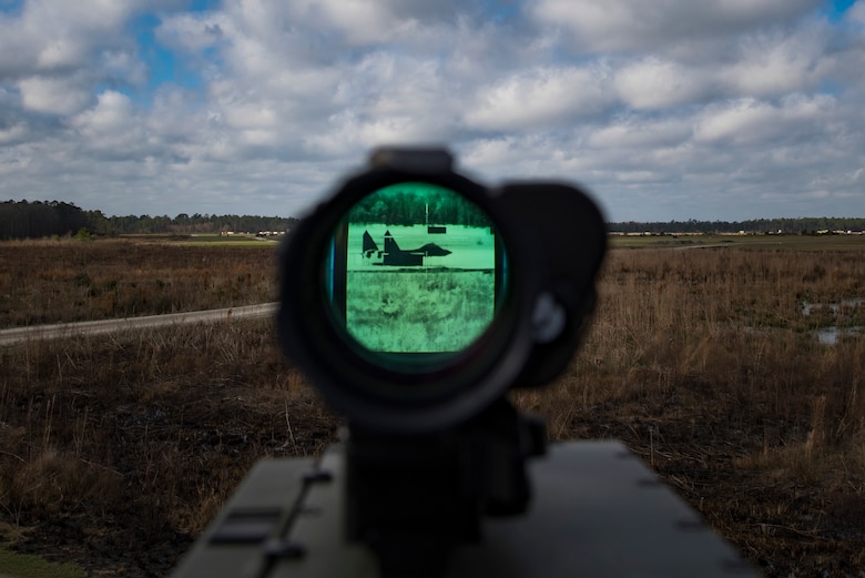 A laser target designator is calibrated to a simulated enemy target location during combined training, Feb. 21, 2018, at Moody Air Force Base, Ga. Ally forces from the Canadian Royal Air Force and New Zealand army traveled to Moody AFB to train with the 75th Fighter Squadron on close air support. (U.S. Air Force photo by Staff Sgt. Eric Summers Jr.)