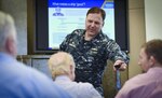 Capt. Mark Vandroff answers a question during the first presentation of the Rear Adm. David W. Taylor Naval Architecture Lecture Series, held Feb. 15, 2018, at the West Bethesda, Md., headquarters of Naval Surface Warfare Center, Carderock Division.