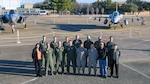 Defense Contract Management Agency Lockheed Martin Fort Worth’s flight operations team is led by Marine Corps Lt. Col. Joe Hutcheson (back row, first from left). The team provides program support and worldwide delivery for the F-35 Lightning II, the F-16 Fighting Falcon and the F-22 Raptor. It is a global effort supported by eight active duty service members, multiple civilians and two Air Force Reserve officers — Lt. Col. Michael Kirk (front row, third from left) and Maj. Kerry McAnally (back row, fourth from left). According to leadership, the pair play a vital role within the mission. (Photo courtesy of Lockheed Martin Aeronautics-Angel DelCueto)