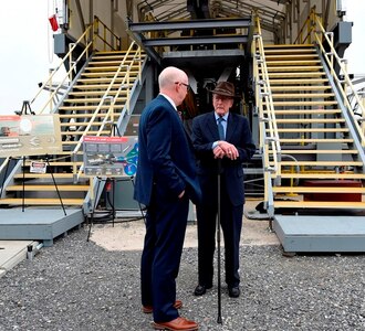 IMAGE: DAHLGREN, Va. (Feb. 22, 2018) – Retired Adm. James Hogg, right, talks with Don McCormack, executive director of the Naval Surface and Undersea Warfare Centers, during a visit to the electromagnetic railgun at Naval Surface Warfare Center Dahlgren Division. Adm. Hogg and Dr. Hans Mark, former Secretary of the Air Force, were honored during an electromagnetic railgun line naming ceremony. As public servants, Hogg and Mark laid the foundation for the U.S. Navy Railgun Program and led the effort to explore and illustrate to senior leadership the warfighting advantages of this game-changing technology and were pivotal in gaining the initial funding necessary to demonstrate its feasibility. (U.S. Navy photo by John F. Williams/Released)