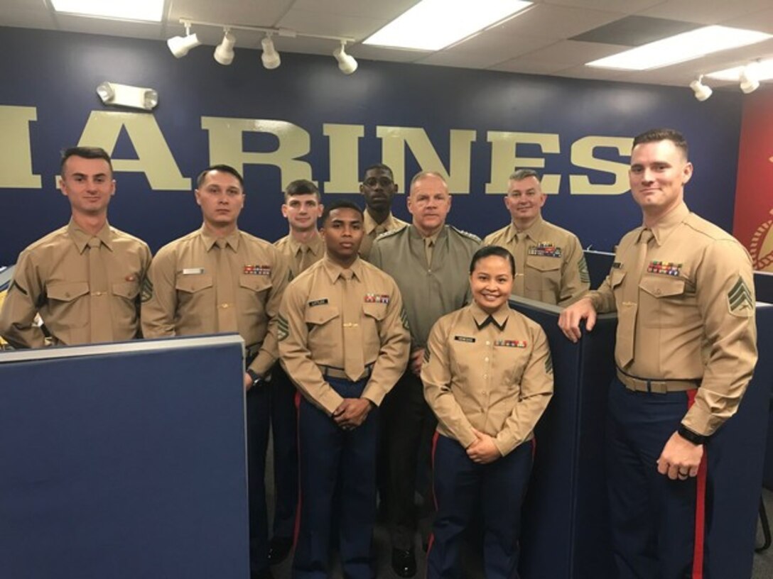 U.S. Marines with Recruiting SubStation (RSS) Charlotte pose for a photo with General Robert B. Neller, Commandant of the Marine Corps, at RSS Charlotte in Charlotte, North Carolina Feb. 12, 2018.
