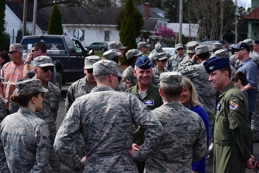 Lt. Gen. Jay Silveria, superintendent of the U.S. Air Force Academy, Colo., center, and Col. Christopher Sage, 4th Fighter Wing commander, right, talk with members of Team Seymour before game two of the 2018 Freedom Classic, Feb. 24, 2018, at Grainger Stadium in Kinston, North Carolina. The Falcons lost the series against the Midshipmen 2-1. (U.S. Air Force photo by Airman 1st Class Kenneth Boyton)