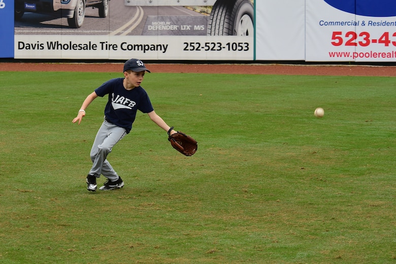 Jonathan Sage catches a ball during the kid's clinic before game two of the 2018 Freedom Classic, Feb. 24, 2018, at Grainger Stadium in Kinston, North Carolina. Players from the Air Force Falcons and the Navy Midshipmen baseball teams ran the clinic, with more than 30 children in attendance. (U.S. Air Force photo by Airman 1st Class Kenneth Boyton)