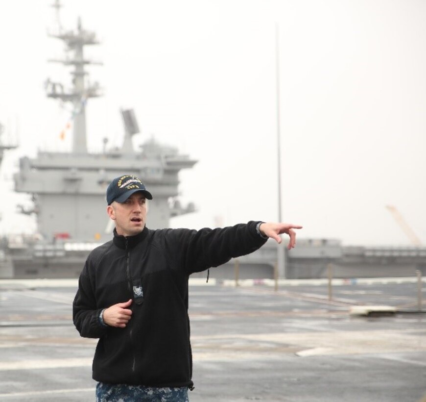Chief Petty Officer 1st Class Andrew Halcomb, aviation boatswain equipment, USS Gerald R. Ford (CVN 78), is showing the group of Marines different parts of the ship’s flight deck aboard the USS Ford, Naval Station Norfolk, Va., Feb. 23. Halcomb showed the Marines different parts of the flight deck and aircraft launch and landing procedures between the flight deck and tower. (Official U.S. Marine Corps photo by Sgt. Mark Tuggle/Released)





Petty Officer 1st Class Andrew Halcomb, aviation boatswain equipment specialist, USS Gerald R. Ford (CVN 78), is showing the group of Marines different parts of the ship’s flight deck aboard the USS Ford, Naval Station Norfolk, Va., Feb. 23. Halcomb showed the Marines different parts of the flight deck and aircraft launch and landing procedures between the flight deck and tower. (Official U.S. Marine Corps photo by Sgt. Mark Tuggle/Released)