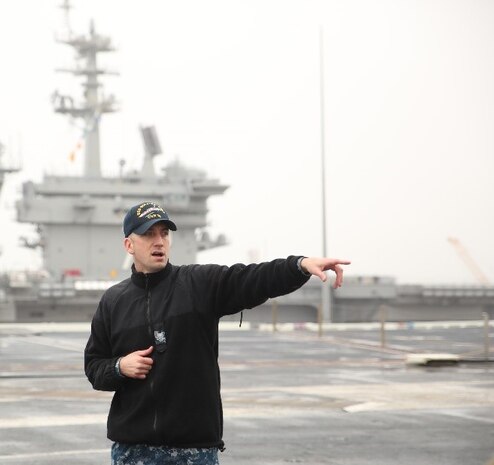 Chief Petty Officer 1st Class Andrew Halcomb, aviation boatswain equipment, USS Gerald R. Ford (CVN 78), is showing the group of Marines different parts of the ship’s flight deck aboard the USS Ford, Naval Station Norfolk, Va., Feb. 23. Halcomb showed the Marines different parts of the flight deck and aircraft launch and landing procedures between the flight deck and tower. (Official U.S. Marine Corps photo by Sgt. Mark Tuggle/Released)





Petty Officer 1st Class Andrew Halcomb, aviation boatswain equipment specialist, USS Gerald R. Ford (CVN 78), is showing the group of Marines different parts of the ship’s flight deck aboard the USS Ford, Naval Station Norfolk, Va., Feb. 23. Halcomb showed the Marines different parts of the flight deck and aircraft launch and landing procedures between the flight deck and tower. (Official U.S. Marine Corps photo by Sgt. Mark Tuggle/Released)