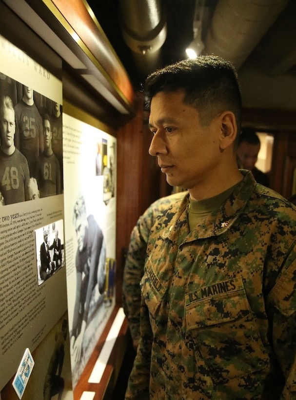 Maj. Arleigh Lacefield, operations officer, Headquarters and Service Battalion, U.S. Marine Corps Forces Command, reads historical documents in the ship’s museum aboard the USS Gerald R. Ford (CVN 78), Naval Station Norfolk, Va., Feb. 23. The Marines from MARFORCOM and Wounded Warrior Detachment Portsmouth, Wounded Warrior Regiment, had a chance to review the history on The Honorable Mr. Gerald R. Ford before starting the ship tour. (Official U.S. Marine Corps photo by Sgt. Mark Tuggle/Released)