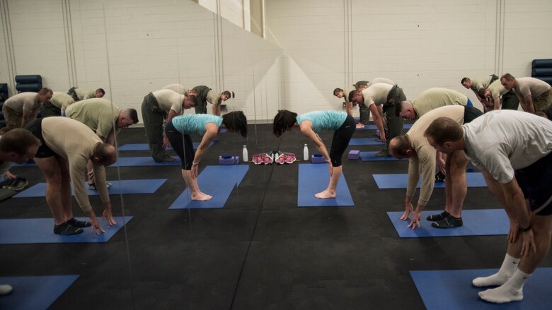 58th Special Operations Wing Airmen perform yoga at a performance skills workshop at Kirtland Air Force Base, N.M., Feb. 12. The workshop is a monthly battery of instruction being offered to students so they can be the best version of themselves.