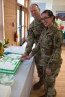 U.S. Army Col. Ralph L. Clayton III, 733rd Mission Support Group commander, and Pvt. Diana Martinez, cargo specialist, 149th Company, 10th Battalion, 7th Transportation Brigade, cut a cake at Fort Eustis' Lakeside Sports Bar at Joint Base Langley-Eustis, Virginia, Feb. 23, 2018. In keeping with Army tradition, the youngest soldier at the ceremony helped Clayton cut the cake. (U.S. Air Force photo by Airman 1st Class Monica Roybal)