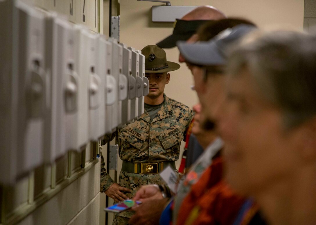 Staff Sergeant Fernando Castro, a drill instructor with Recruit Training Regiment, instructs attendees on the initial phone call of Marine Corps Recruit Training during the Educators Workshop aboard Marine Corps Recruit Depot Parris Island, South Carolina, Feb. 21, 2018. These educators traveled from Recruiting Station (RS) Atlanta and RS Jacksonville to experience the workshop. The workshop allows educators to have an inside look at educational benefits and career opportunities in the Marine Corps to better inform their students. (U.S. Marine Corps photo by Lance Cpl. Jack A. E. Rigsby)