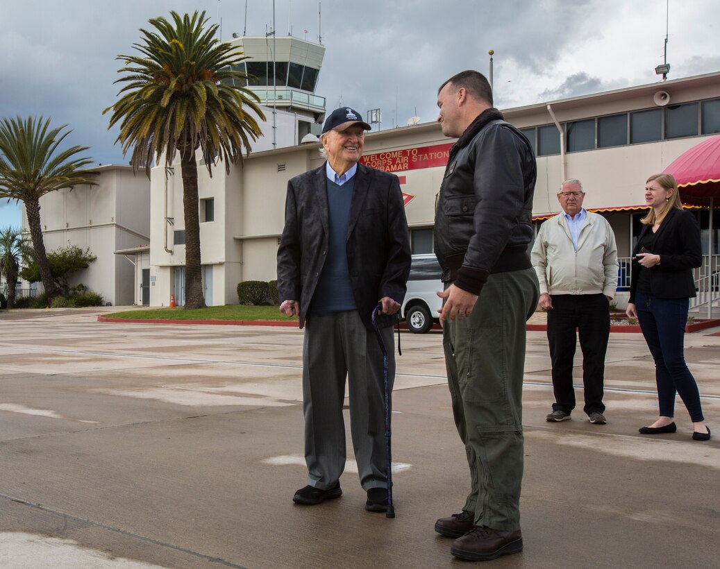 Retired Marine Corps Capt. John Campbell, a Pearl Harbor survivor, visits the flight line of Marine Corps Air Station Miramar, Calif., Feb. 21. MCAS Miramar service members and staff often host military veterans on the installation, enabling them to observe modern military equipment and speak with active duty service members. (U.S. Marine Corps photo by Lance Cpl. Servando Morales/Released)