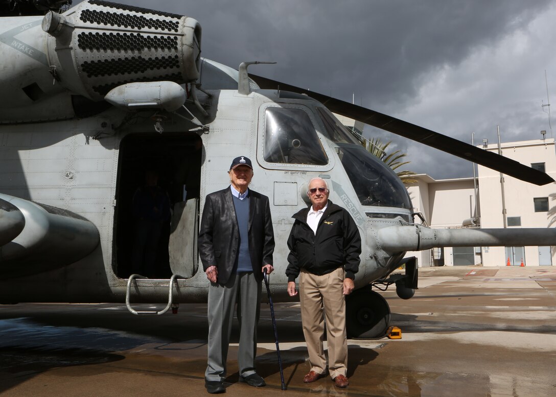 Retired Marine Corps Capt. John Campbell, a Pearl Harbor survivor, visits the flight line of Marine Corps Air Station Miramar, Calif., Feb. 21. MCAS Miramar service members and staff often host military veterans on the installation, enabling them to observe modern military equipment and speak with active duty service members. (U.S. Marine Corps photo by Lance Cpl. Servando Morales/Released)