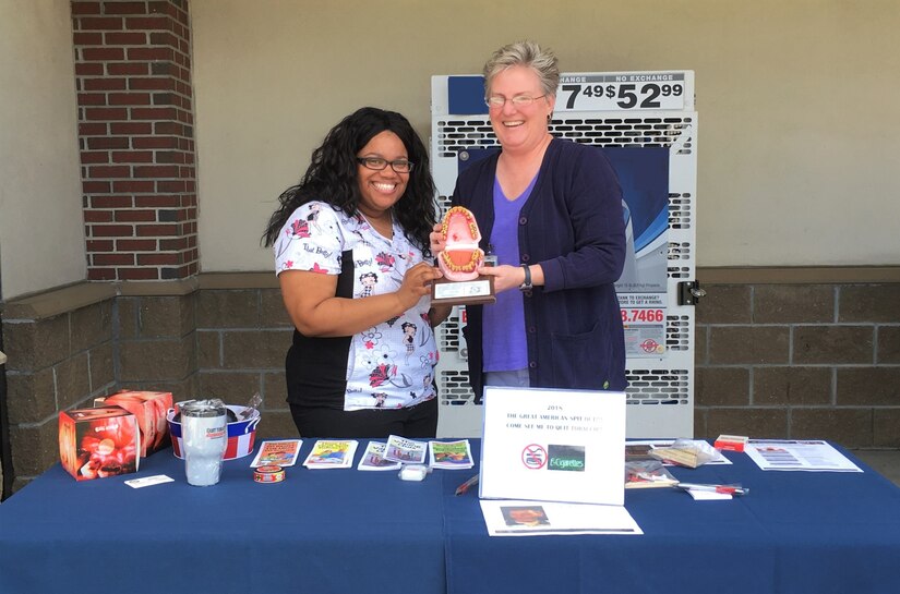 Kia Reese, left, dental hygienist for Naval Health Clinic Charleston's Dental Clinic, and Theresa Wood, director for NHCC’s Health and Wellness Program, educate patrons of the Naval Weapons Station Mini-mart about the many health hazards associated with using tobacco products during the Great American Spit Out Feb. 22. Do you dip but want to quit? If you are interested in stopping the use of tobacco products, visit Naval Health Clinic Charleston's Health and Wellness Clinic or call 843-794-6910 to inquire about quitting. NHCC staff is standing by to help you quit and stay quit.