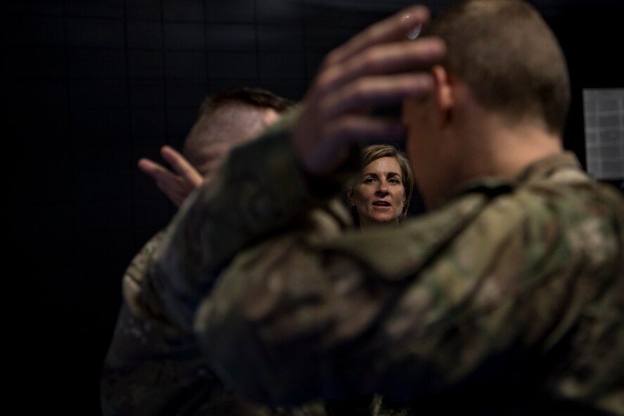 Col. Jennifer Short, 23d Wing commander, watches as Airmen from the 347th Operations Support Squadron demonstrate combative techniques used in Survival, Evasion, Resistance and Escape (SERE) training during a 347th Rescue Group immersion, Feb. 26, 2018, at Moody Air Force Base, Ga. During the immersion, 23d WG leadership was given an in-depth briefing and demonstration of how SERE specialists and Independent Duty Medical Technicians ensure Moody’s aircrew have the skills to survive in the worst of situations. (U.S. Air Force photo by Senior Airman Daniel Snider)