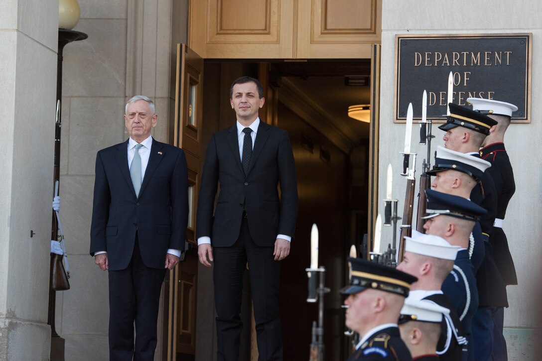 Defense Secretary James N. Mattis stands next to the Montenegrin defense minister.