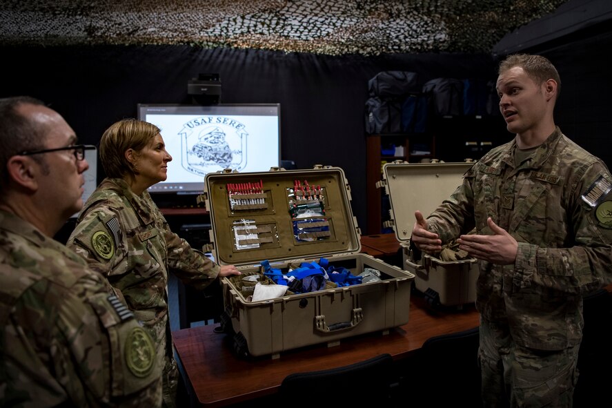 Staff Sgt. Cory Newby, 347th Operations Support Squadron independent-duty medical technician, right, briefs Col. Jennifer Short, 23d Wing commander, and Chief Master Sgt. Jarrod Sebastian, 23d Wing command chief, on training tools and techniques used during Tactical Combat Casualty Care courses, during a 347th Rescue Group immersion, Feb. 26, 2018, at Moody Air Force Base, Ga. During the immersion, 23d WG leadership was given an in-depth briefing and demonstration of how SERE specialists and Independent Duty Medical Technicians ensure Moody’s aircrew have the skills to survive in the worst of situations. (U.S. Air Force photo by Senior Airman Daniel Snider)