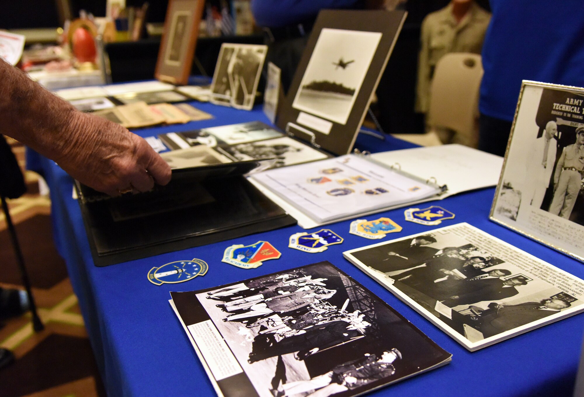 Pat Byrd, Biloxi resident, views Keesler Air Force Base memorabilia during the Gulf Coast Historical and Cultural Exposition at the Biloxi Civic Center Feb. 23, 2018, in Biloxi, Mississippi. The event, which consisted of historical and cultural groups displaying the rich and diverse history and culture of the Mississippi Gulf Coast, also showcased both Keesler AFB and Air Force history. (U.S. Air Force photo by Kemberly Groue)