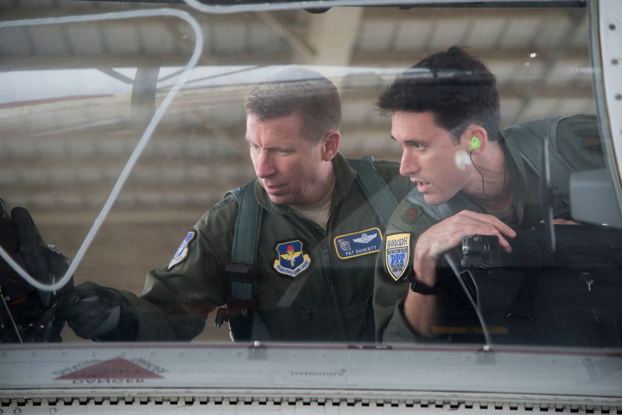 U.S. Air Force Maj. Gen. Patrick Doherty, 19th Air Force commander, and Maj. Lincoln Olsen, T-6 instructor pilot, conduct a T-6 Texan II safety check before conducting an operational demonstration at Joint Base San Antonio-Randolph, Texas, Feb. 21, 2018. Doherty was on the flightline getting test data first-hand during the command-wide T-6 operational pause. (U.S. Air Force photo by Sean Worrell)