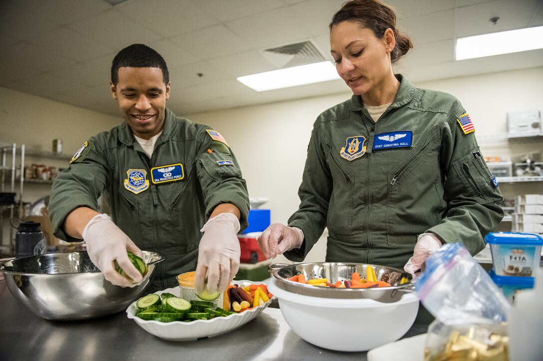 Total force effort by 73rd AS and 54th AS to prep food for outbound missions.