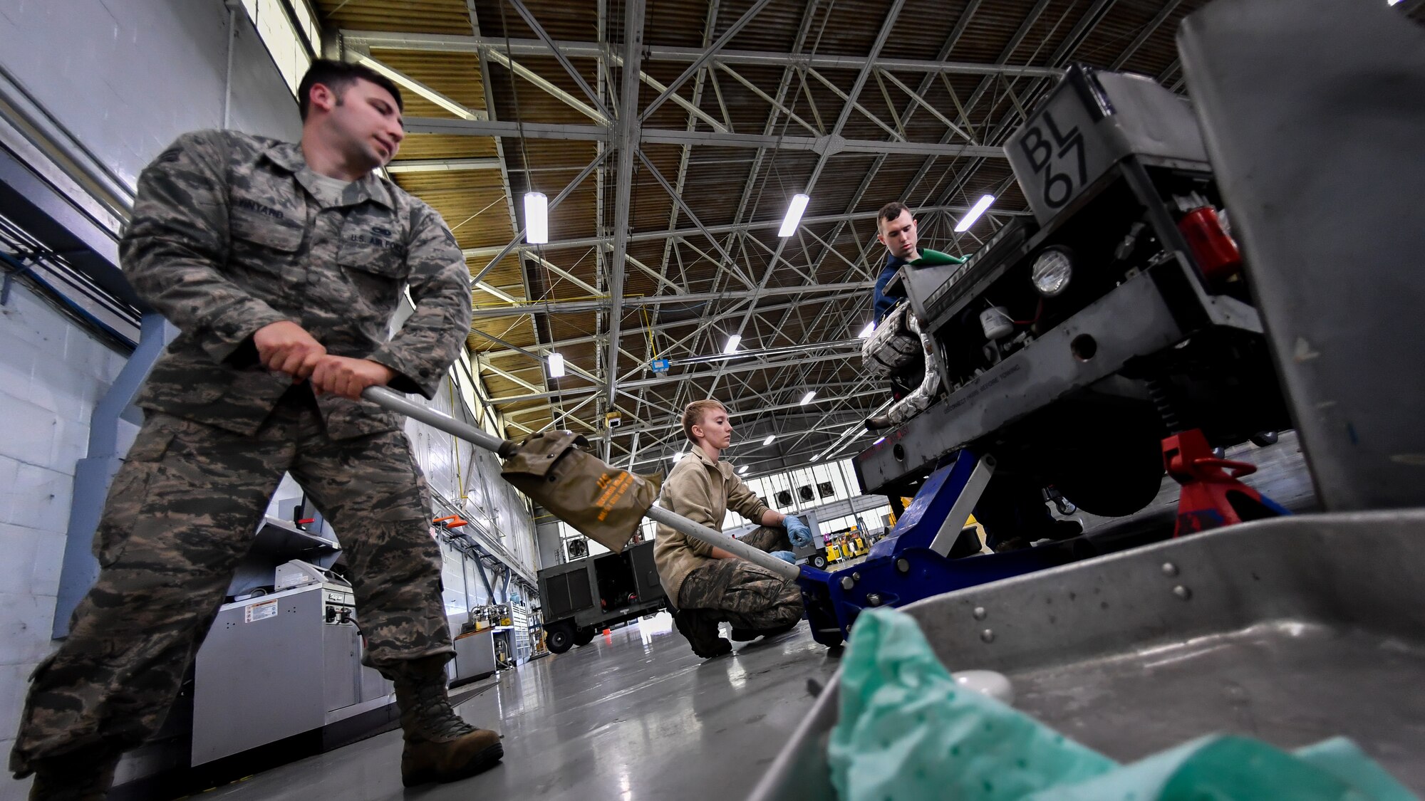 Aerospace ground equipment technicians lift a bomb loader vehicle prior to a tire change at Barksdale Air Force Base, La., Feb. 27, 2018. The annual safety inspection also allowed Airmen to inspect tires, gaskets and others parts of the vehicle.