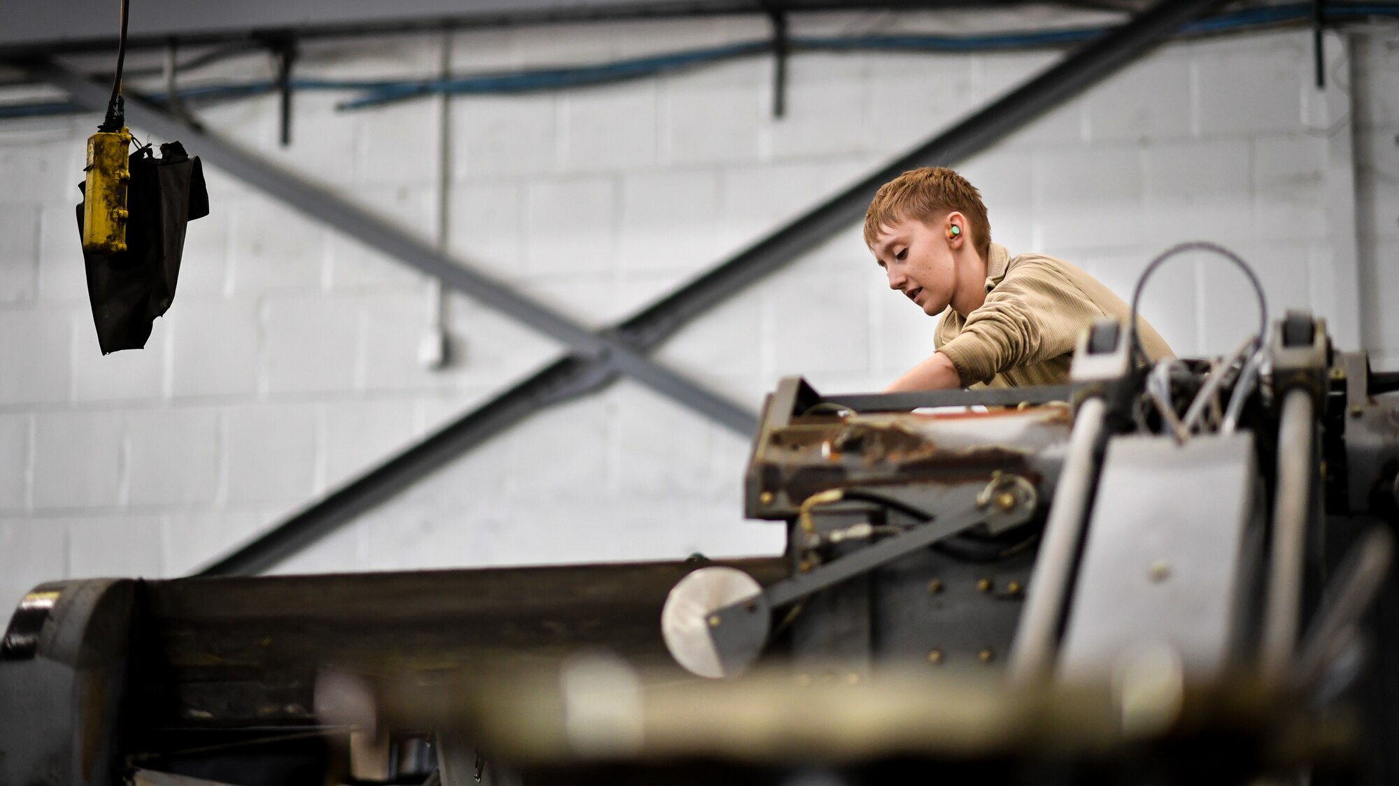 Airman Abigail Weber, 2nd Maintenance Squadron aerospace ground equipment technician, starts a bomb loader vehicle after an engine oil change at Barksdale Air Force Base, La., Feb. 27, 2018. Weber started the vehicle as the last step of the oil change process to verify the vehicle is ready for daily operations.