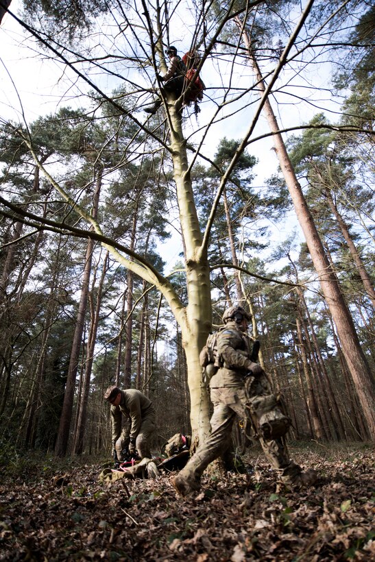 Several 57th Rescue Squadron pararescuemen prepare to recover a pilot in simulated distress during a training scenario for exercise Point Blank at the Stanford Training Area, England, Feb. 27. The mission of Point Blank is to prepare coalition warfighters for engagements in highly contested, multidimensional battlespaces through advanced training in support of U.S. and U.K. national interests. (U.S. Air Force photo/Senior Airman Malcolm Mayfield)