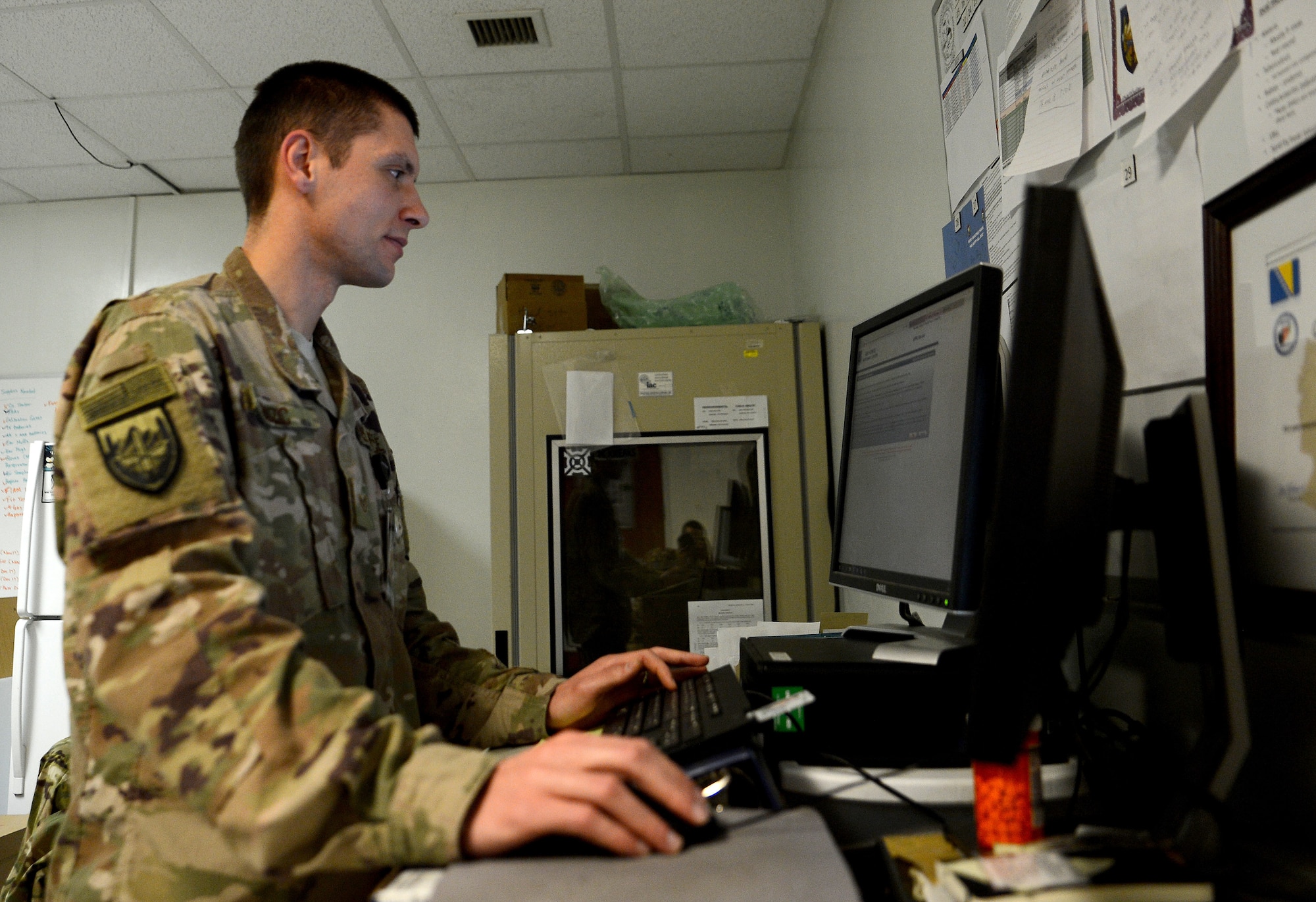 Staff Sgt. Nikola Bozic, 455th Expeditionary Medical Group public health technician, inputs data into his computer after conducting his routine food inspection of the Grady dining facility Feb. 15, 2018 at Bagram Airfield, Afghanistan.
