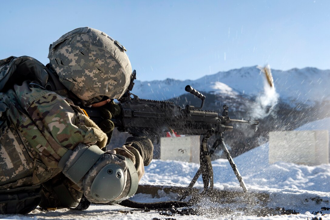 Army Pfc. Miranda Argueta fires the M249 light machine gun during training.